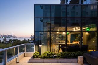 the glass facade of a restaurant with a view of the water