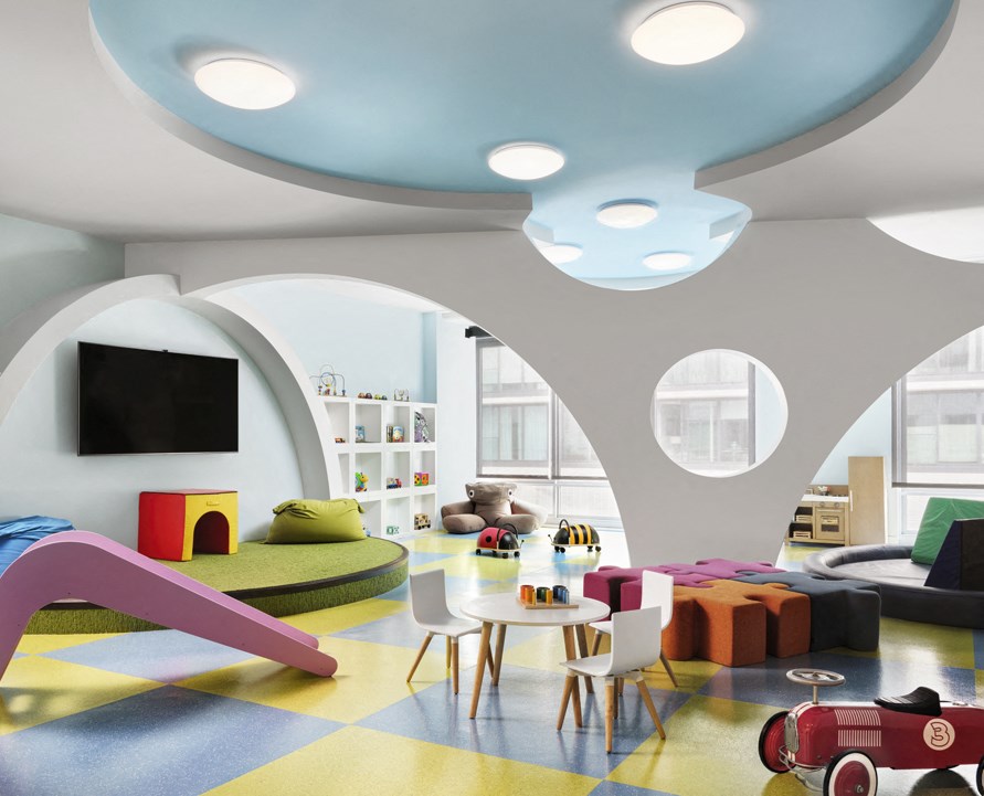 a living room filled with furniture and a tv