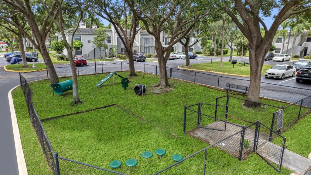 a playground in a park next to a street