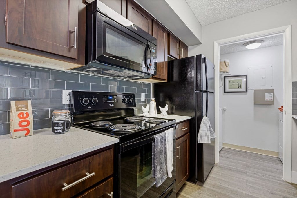 a kitchen with a stove microwave and refrigerator