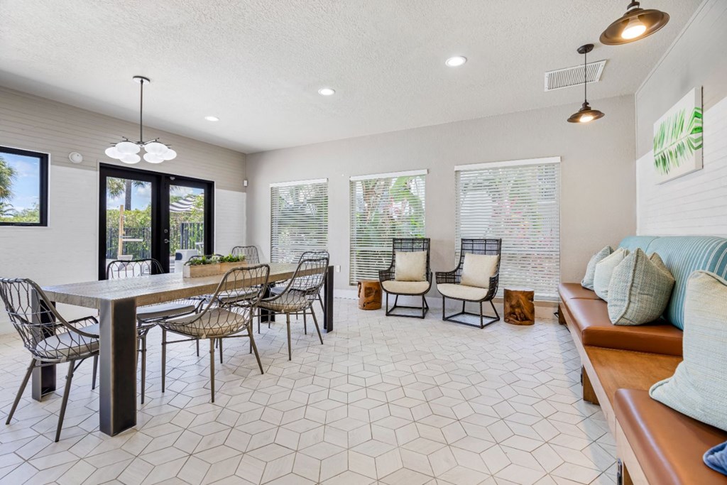 a living room with a table and chairs and a couch