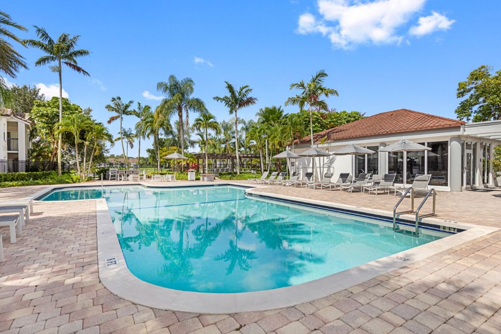 a swimming pool with a building in the background