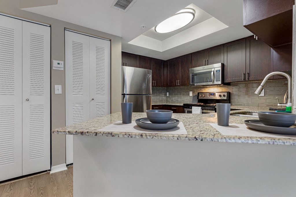 a kitchen with a granite counter top and a sink