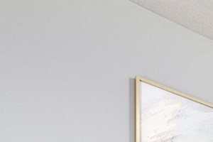 bedroom with an area rug, large painting and bed - Photo Gallery 5