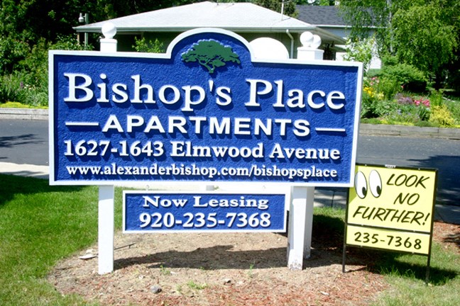 a sign in front of a house that says bishops place apartments