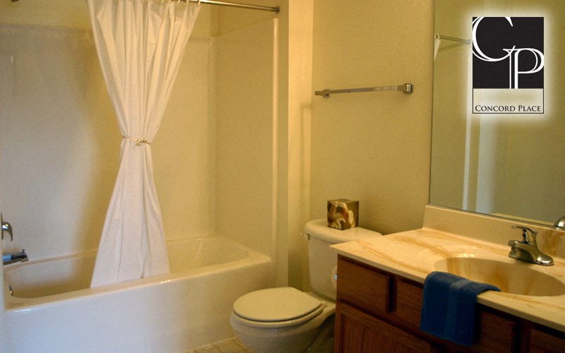 a bathroom with a sink toilet and a bath tub