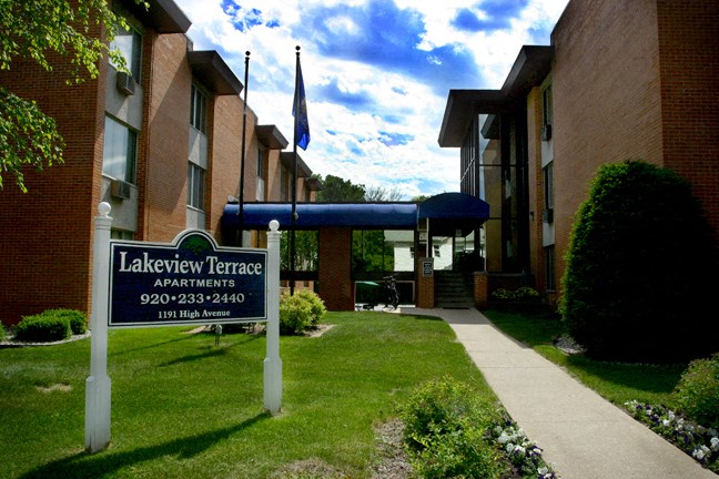 the exterior of lakeview terrace apartments with a sign in front of the building
