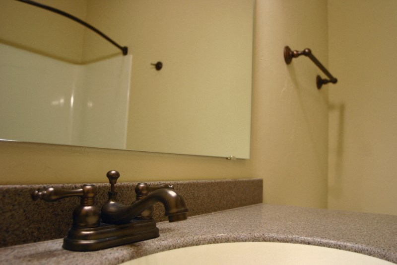 a bathroom with a sink and a mirror