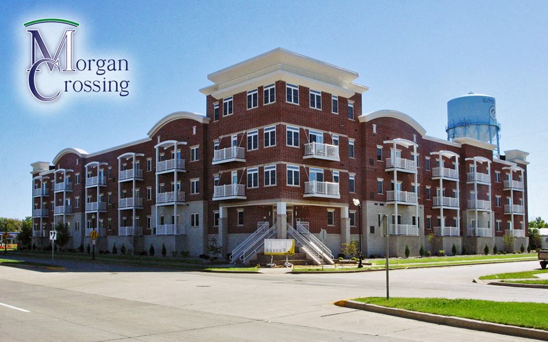 a large brick building with a water tower in the background