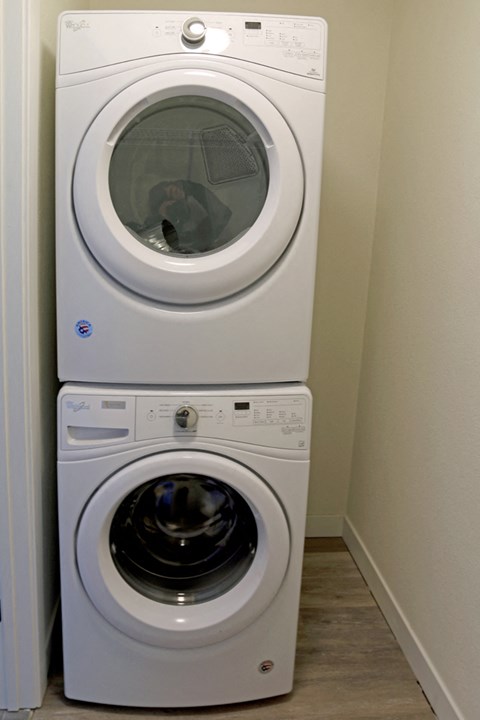 a washing machine and a dryer in a laundry room