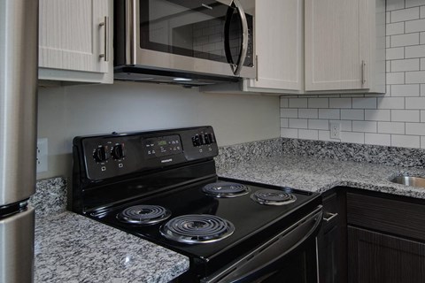 a kitchen with a stove and a microwave