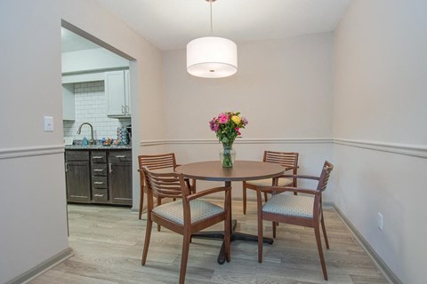 a dining room with a table and chairs