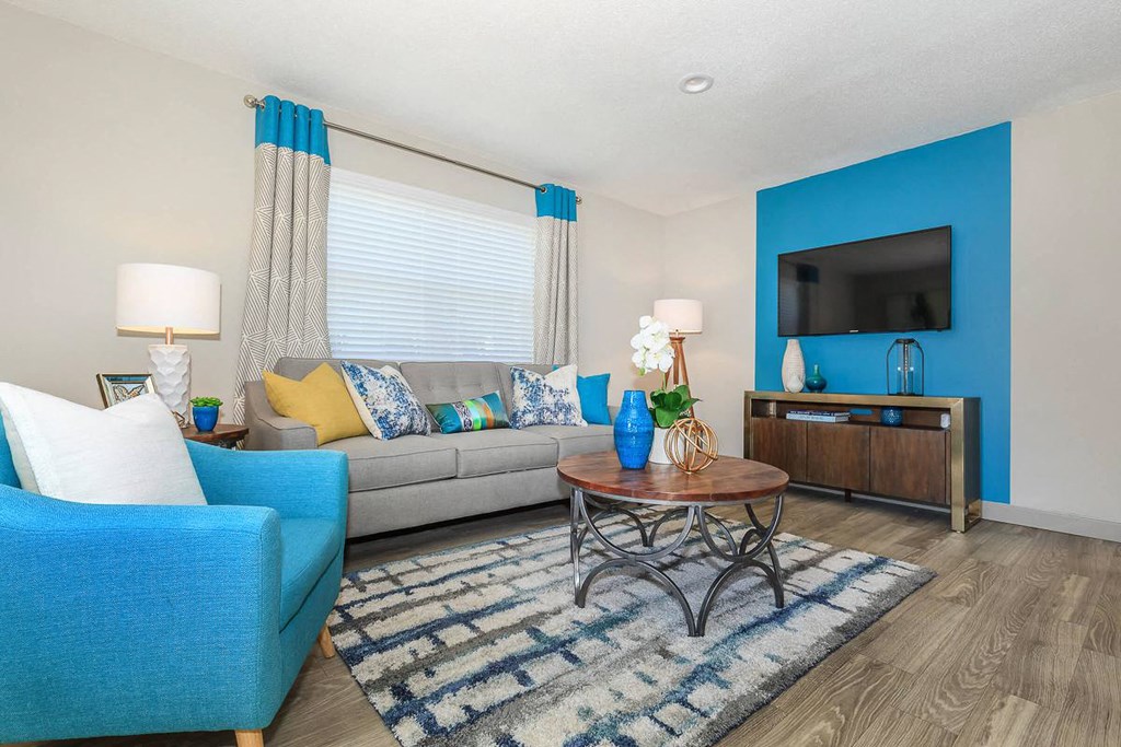 a living room with a couch and a tv