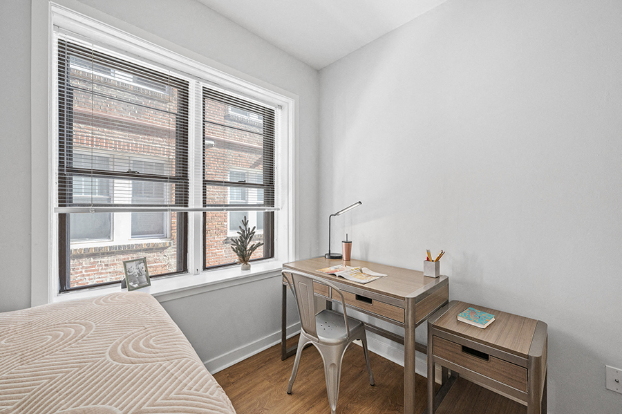 Spacious desk next to large windows in furnished student apartment for rent in University City