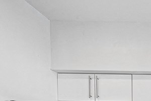 Modern kitchen with stainless steel appliances and white cabinets