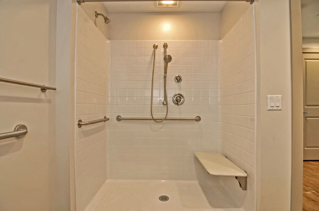 a bathroom with a shower and a toilet in it