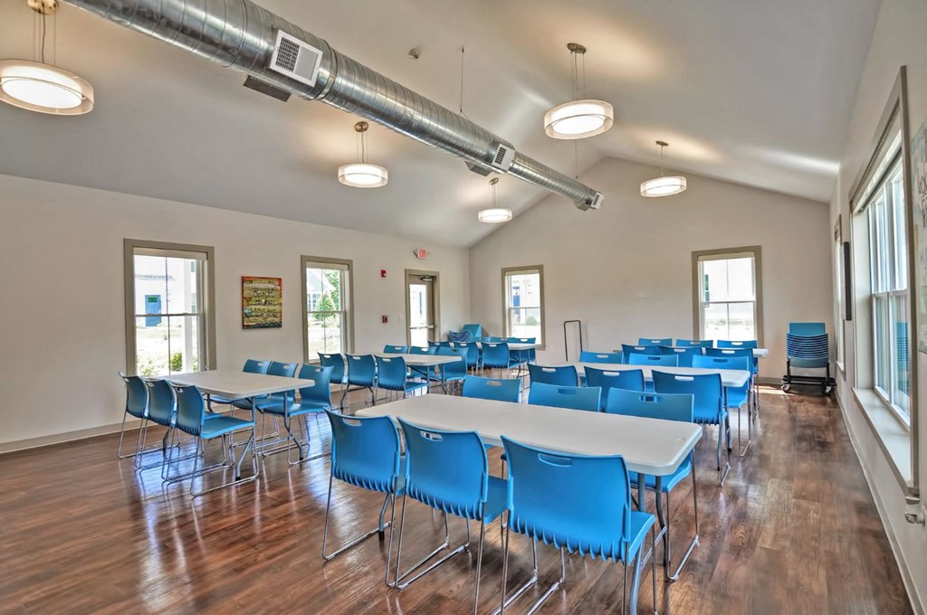 a large conference room with tables and chairs
