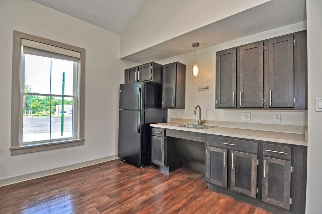 a kitchen with stainless steel appliances and a window