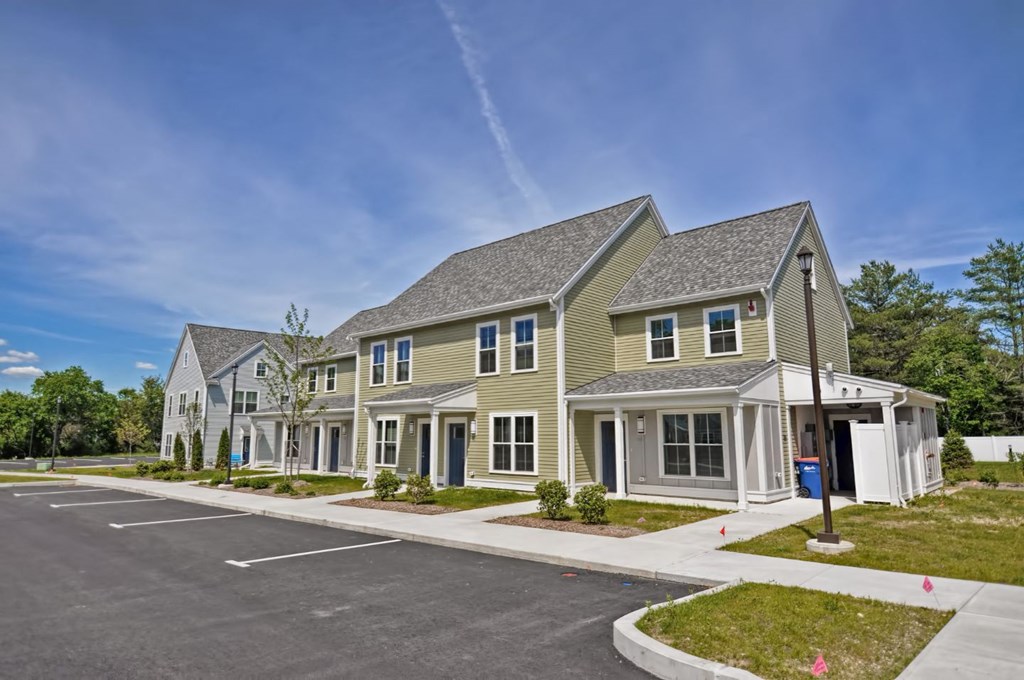 a row of houses on the side of a street