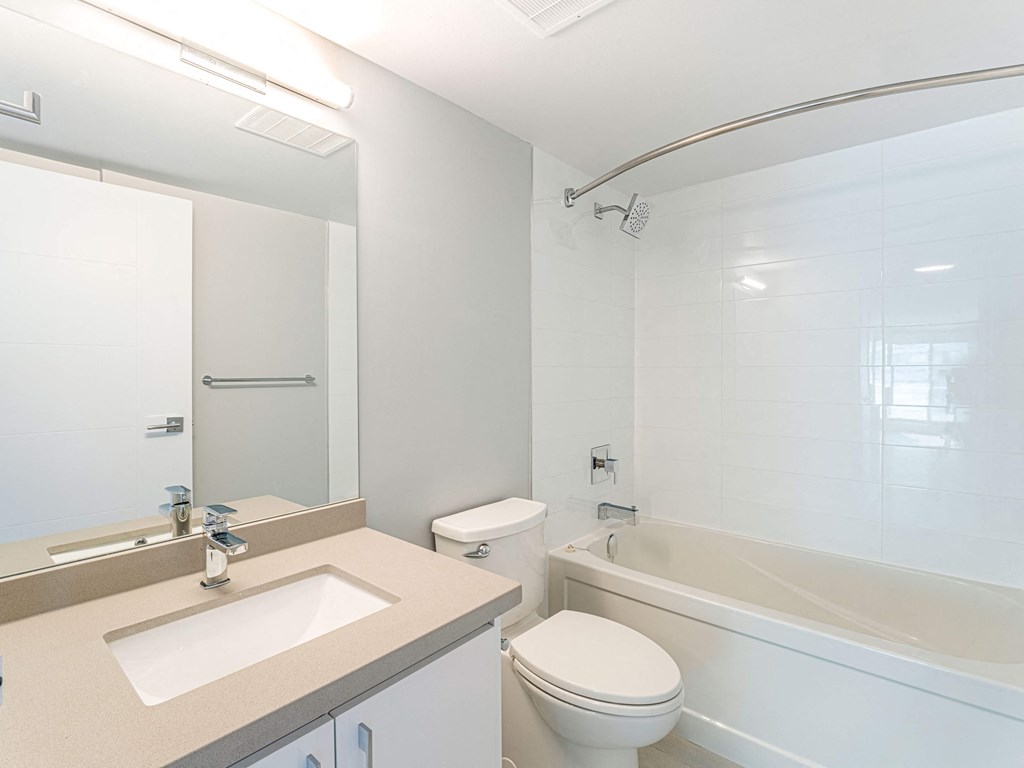 a bathroom with a sink toilet and a tub