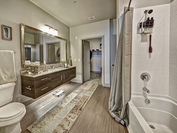 Model Bathroom with Soaking Tub at Dallas Apartment Near Highland Park