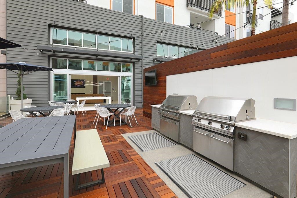 a patio with two stainless steel appliances on it