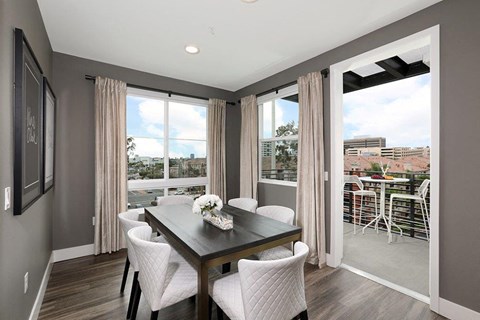 Dining room with table and chairs at Eleven 10 in Orange, CA