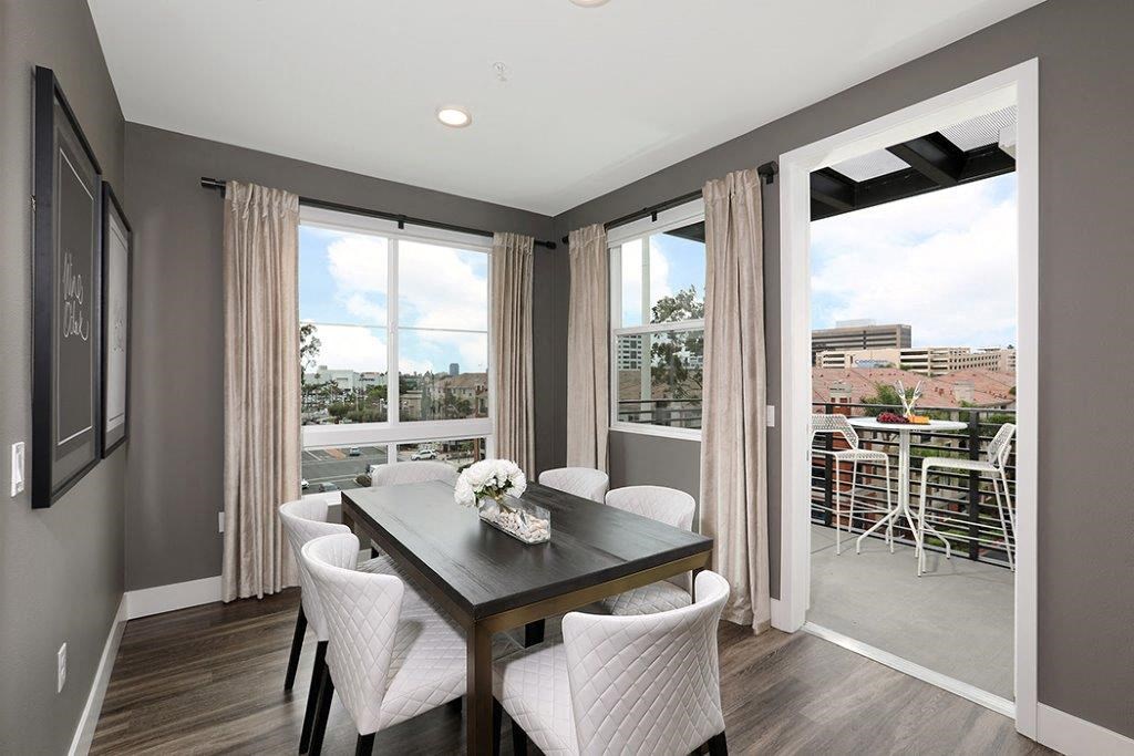 a dining room with a table and chairs