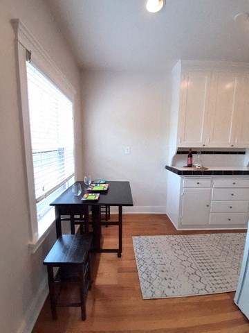 a small kitchen with a table and a window