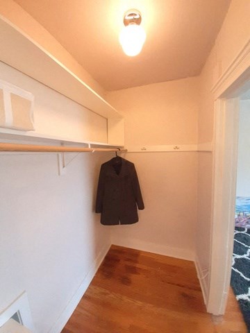 a coat hanging on the wall in a closet