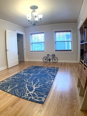 a living room with a blue rug and a bike