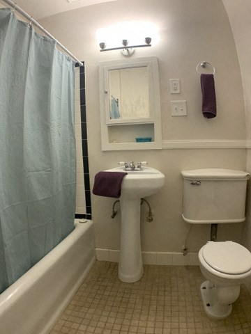 a bathroom with a sink toilet and a shower