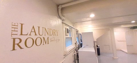 a white room with a sign on the wall