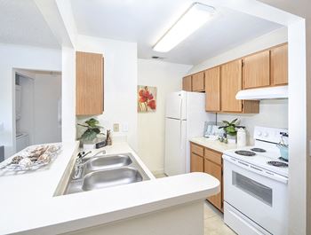 Kitchen with White Appliances and Breakfast Bar