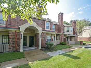 Private Entrances with Lush Green Grass in Front