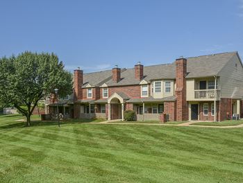 Lush Green Grass In Front Of a Willowbend Apartment Building