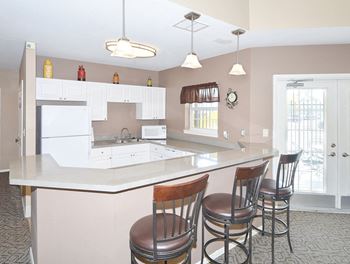 Clubhouse Kitchen with Breakfast Bar and Barstool Seating