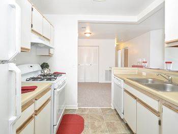 Kitchen with White Appliances and Cabinets