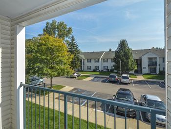 Exterior Balcony Overlooking the Parking Lot and Grass