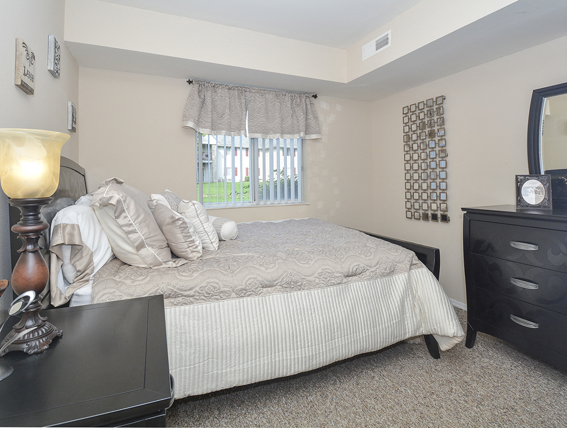 Bedroom with Large Double Window and White Trim