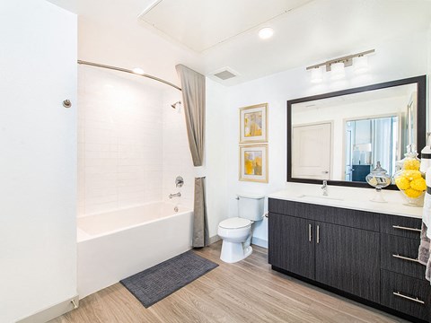 a bathroom with a toilet sink and a bath tub