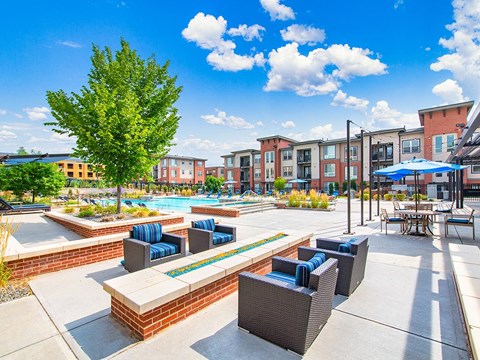 our apartments offer a pool and lounge area with chairs and tables