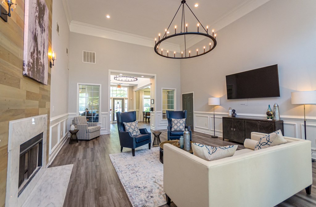 a living room with a fireplace and a tv