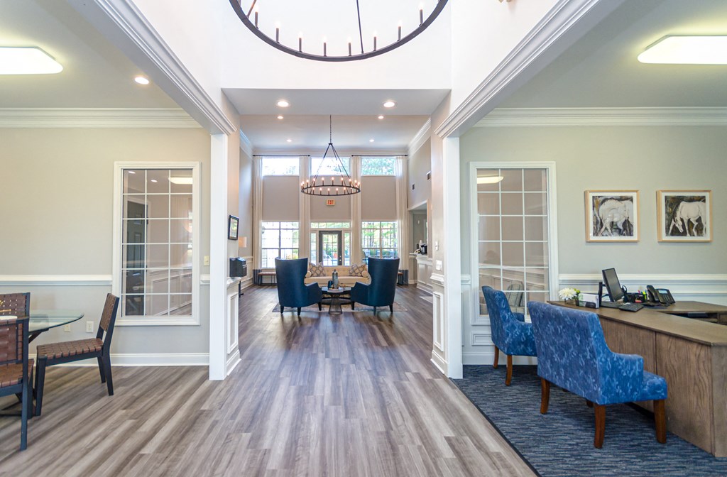 a dining room with a table and chairs and a large chandelier