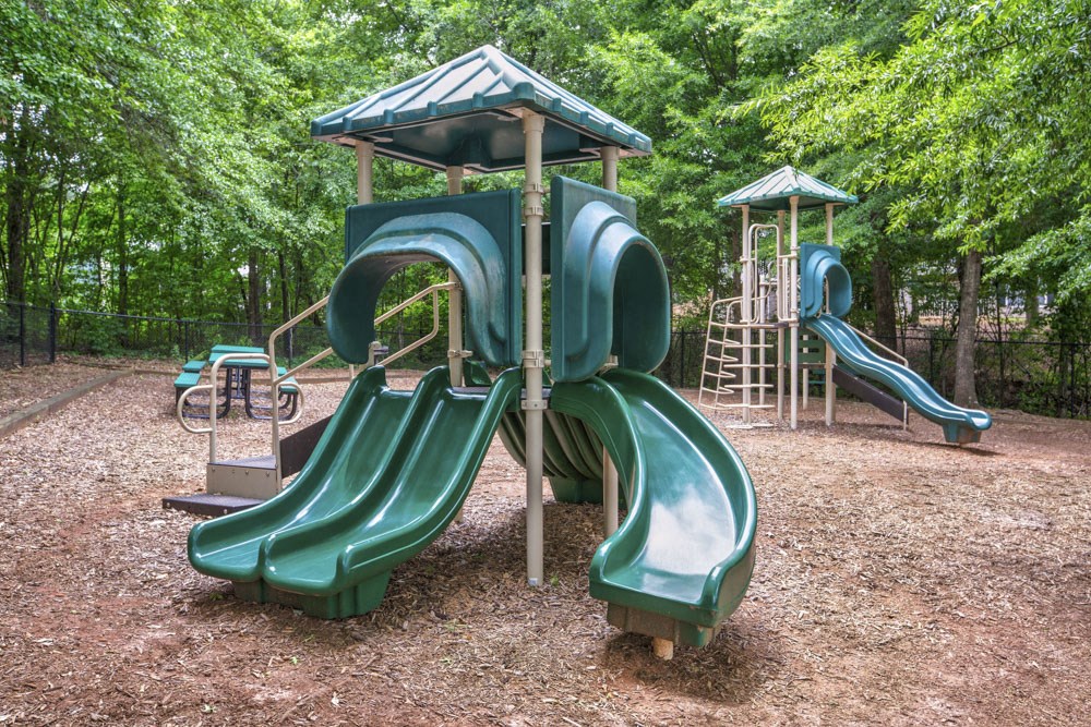a playground with slides at a park