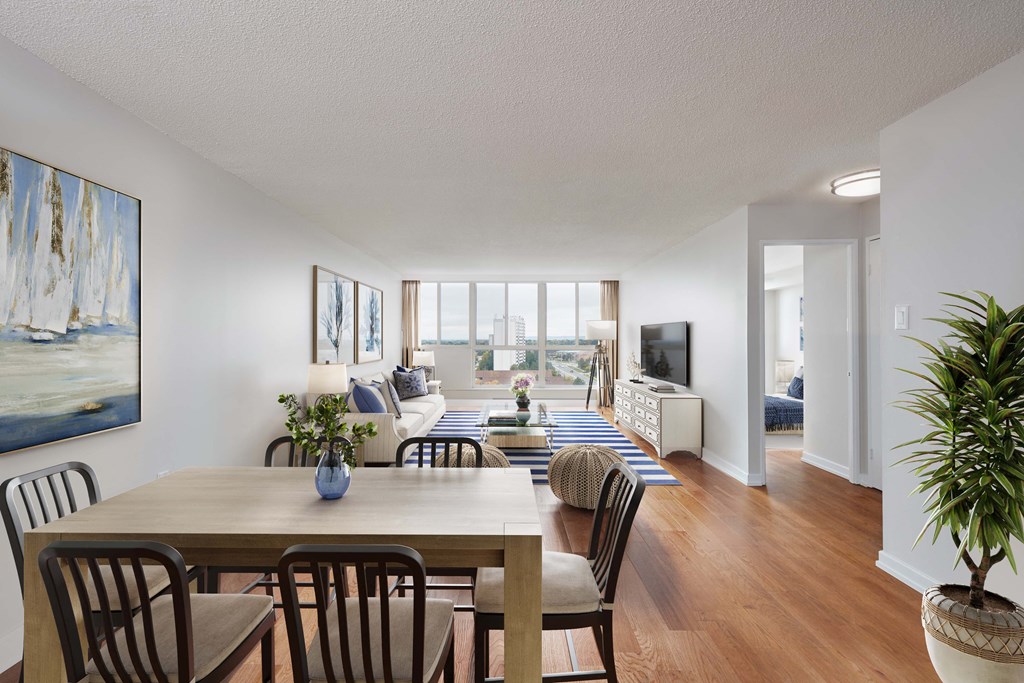 an open living room and dining room with a table and chairs