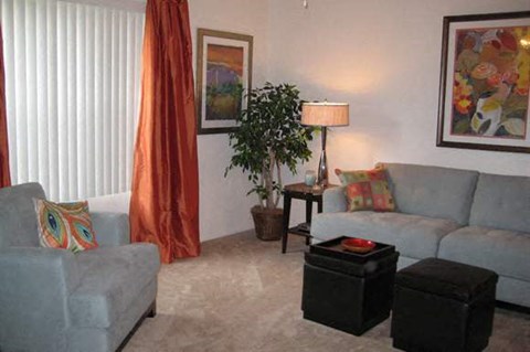 a living room with a couch and a chair