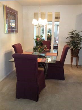 a dining room with a table and chairs