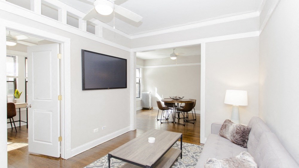 a living room with a couch and a tv