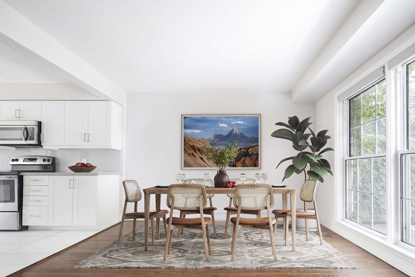 a dining room with a table and chairs